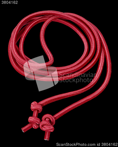 Image of red rope in black back