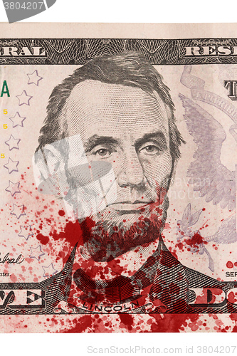 Image of US five Dollar bill, close up, blood