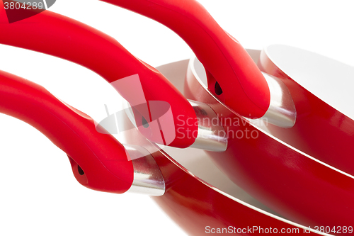 Image of Set of three frying pans, red