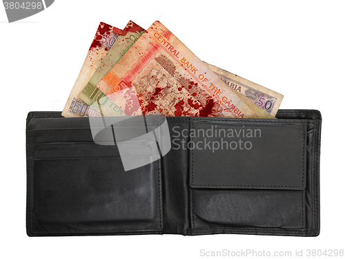 Image of Gambian dalasi bank notes, blood