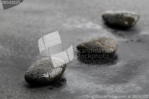 Image of Dark and wet stones for background