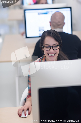 Image of startup business, woman  working on desktop computer