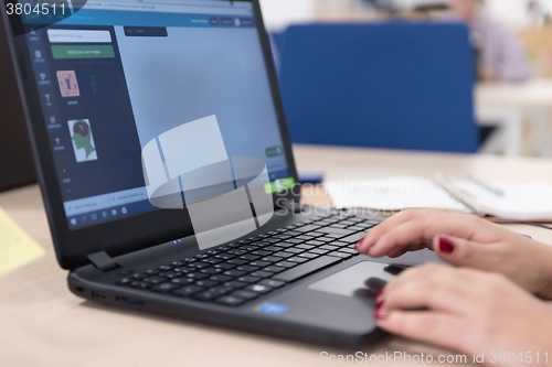 Image of startup business, woman  working on laptop