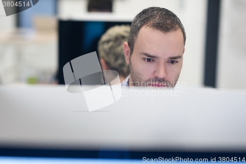 Image of startup business, software developer working on desktop computer