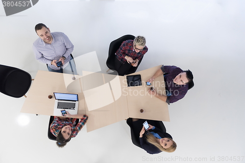 Image of aerial view of business people group on meeting