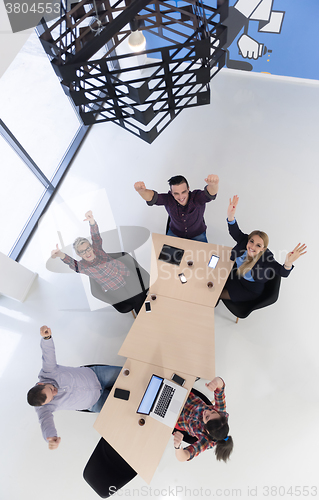 Image of aerial view of business people group on meeting