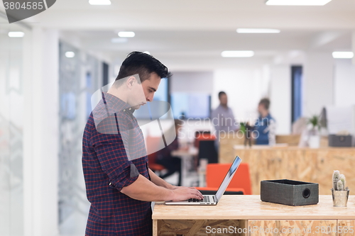 Image of startup business, young  man portrait at modern office