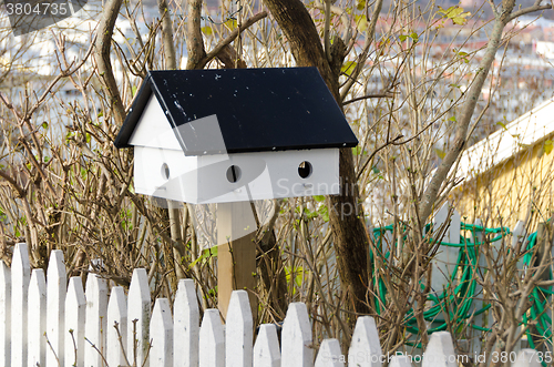 Image of one little birdhouse made of wood