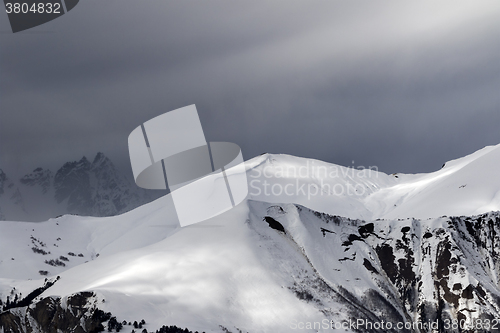 Image of Sunlight mountains with snow cornice and trace from avalanche be