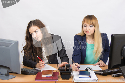 Image of Two young women working in the office