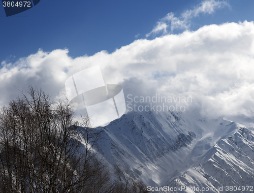 Image of Winter mountains in clouds at nice day