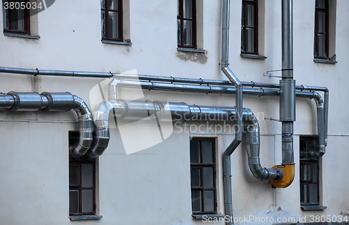 Image of ventilation pipes on the wall of a building