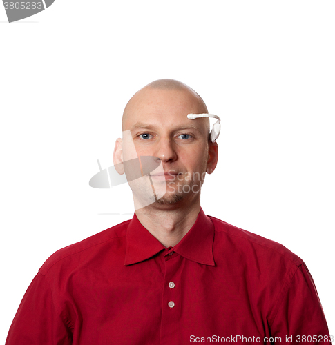 Image of Portrait of young man with handmade EEG headset on head