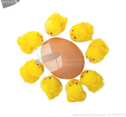 Image of Easter chicks surrounding a large egg