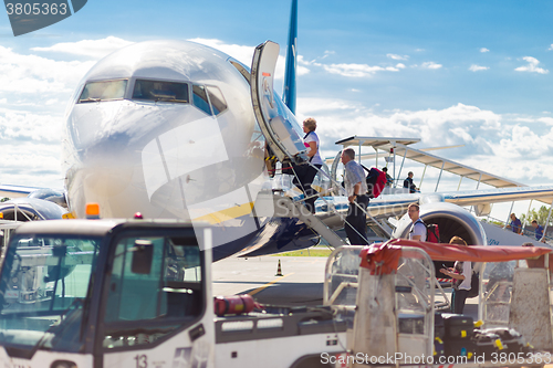 Image of Passangers boarding Ryanair airplane on Treviso airport.