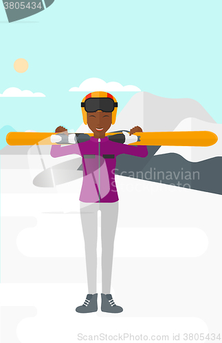 Image of Woman holding skis.