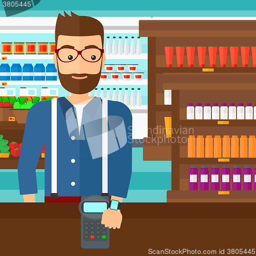Image of Man paying with smart watch.