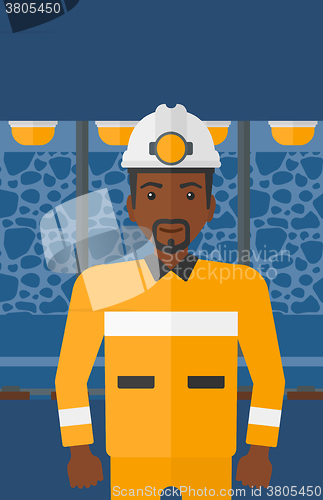 Image of Confident miner in hardhat.