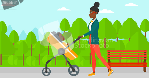 Image of Woman pushing pram.