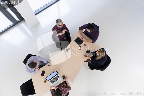 Image of aerial view of business people group on meeting