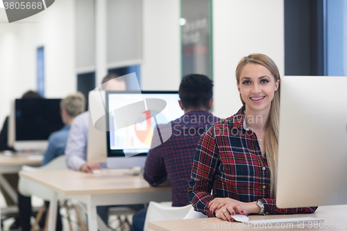 Image of startup business, woman  working on desktop computer