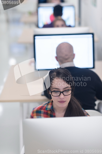 Image of startup business, woman  working on desktop computer