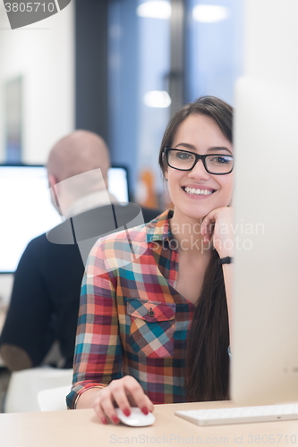 Image of startup business, woman  working on desktop computer