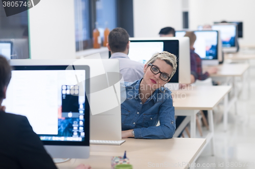 Image of startup business, woman  working on desktop computer