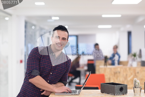 Image of startup business, young  man portrait at modern office