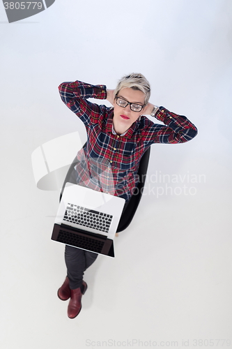 Image of top view of young business woman working on laptop computer