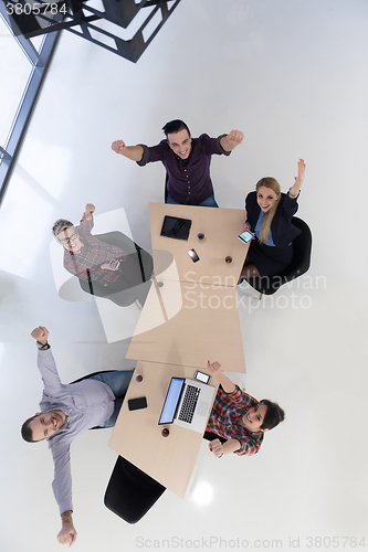 Image of aerial view of business people group on meeting