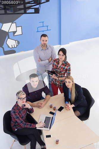 Image of aerial view of business people group on meeting