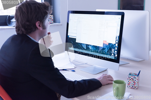 Image of startup business, software developer working on computer