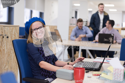 Image of startup business, woman  working on laptop