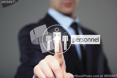 Image of business, technology, internet and networking concept - businessman pressing personnel button on virtual screens