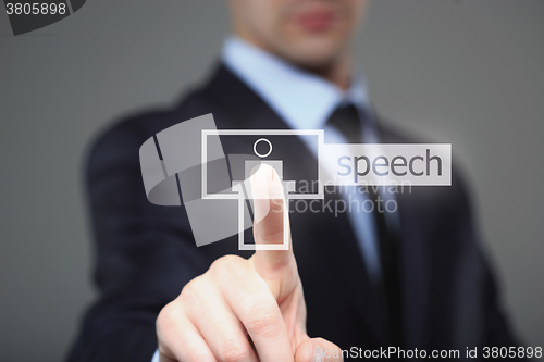 Image of business, technology, internet and networking concept - businessman pressing speech button on virtual screens.