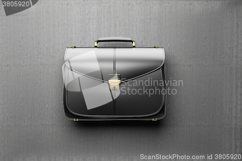 Image of Briefcase on the background of gray concrete wall