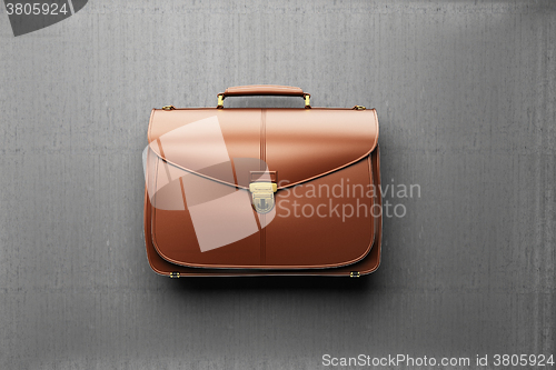 Image of Briefcase on the background of gray concrete wall