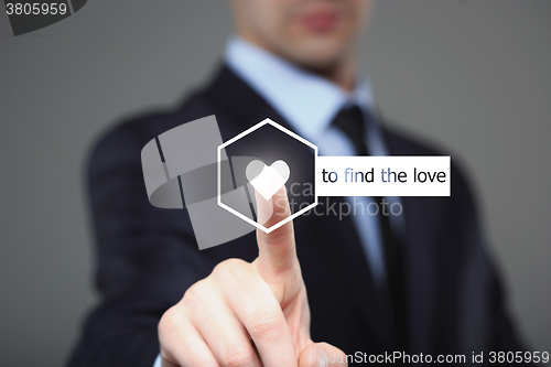 Image of businessman pressing find love button on virtual screens