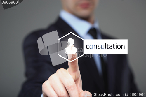 Image of business, technology, internet and networking concept - businessman pressing consultation button on virtual screens