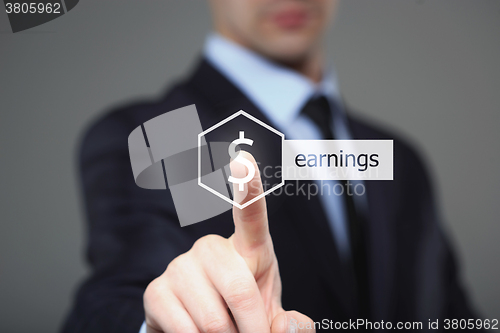 Image of business, technology, internet and networking concept - businessman pressing earnings button on virtual screens