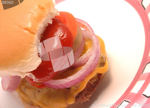 Image of cheeseburger with condiments