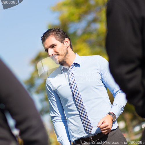 Image of Informal out of office outdoors business meeting.