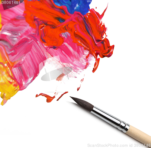 Image of brush and abstract acrylic painted background