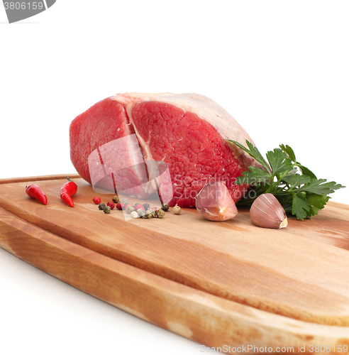 Image of raw meat on wood board