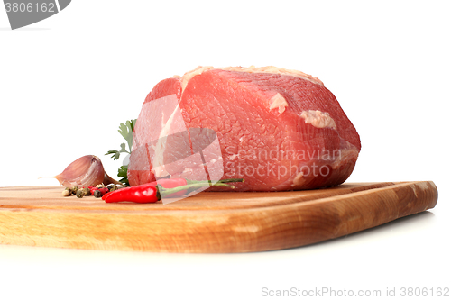 Image of raw meat on wood board