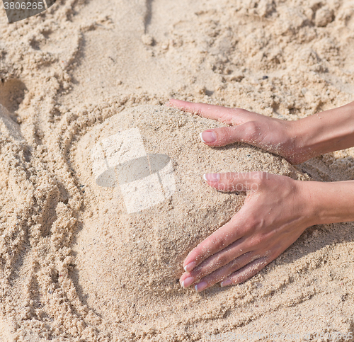 Image of heart shaped sand pile