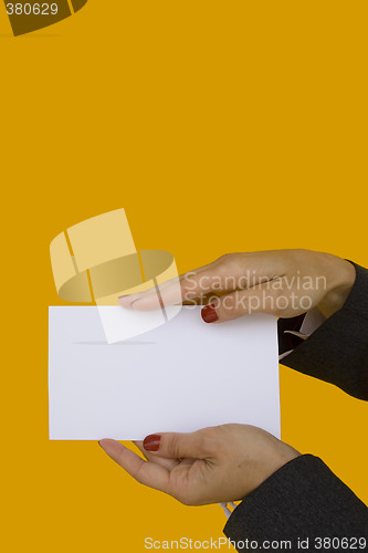 Image of Hands showing card