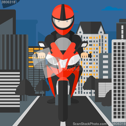 Image of Man riding motorcycle.