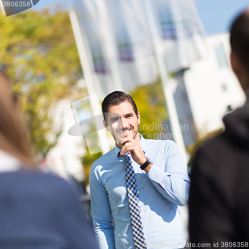 Image of Informal out of office outdoors business meeting.